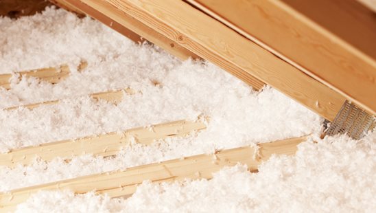 Blown-in insulation on an attic floor