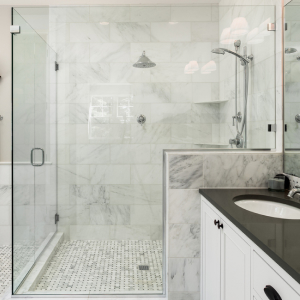 Modern shower with a large glass door.